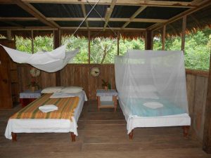 Bungalow at the retreat (with mosquito net overhanging on bed)