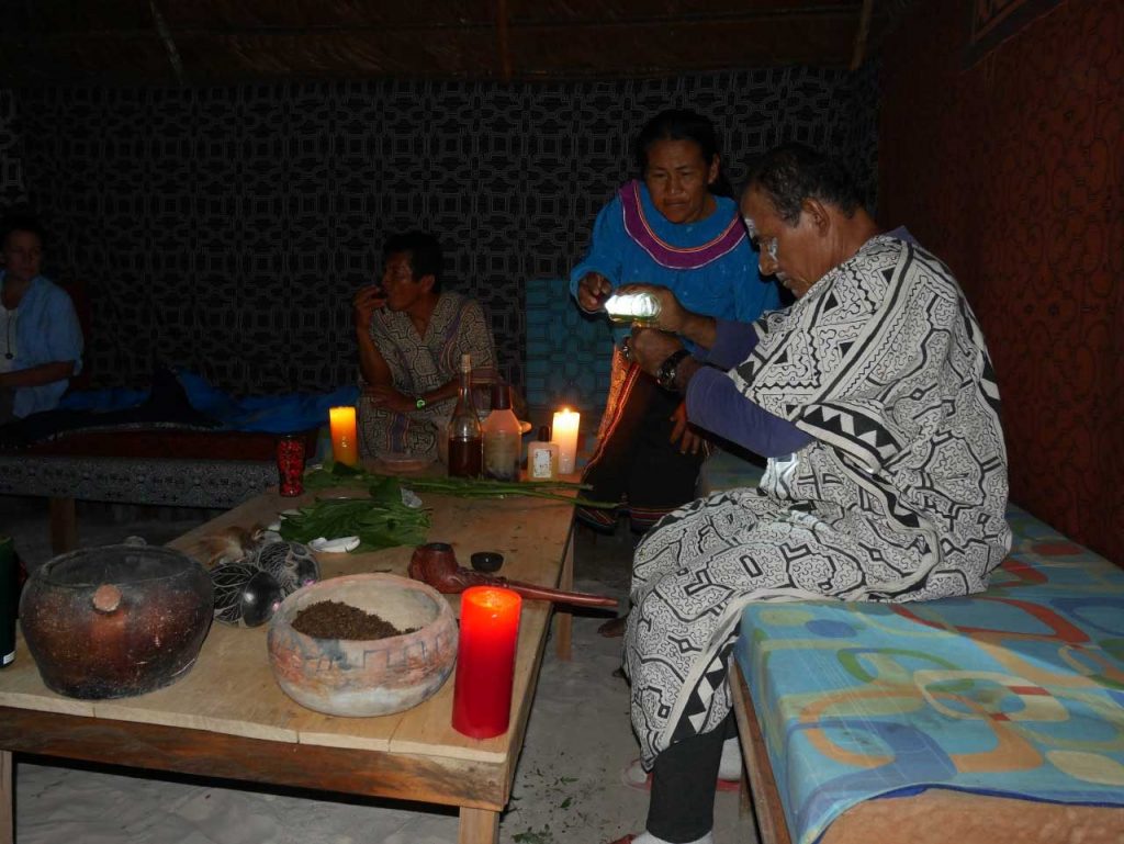 Toé (Brugmansia suaveolens) ceremony at night, with master shaman Don Guido and Shipibo Maestra Celia, in our centre in the Peruvian Amazon rainforest