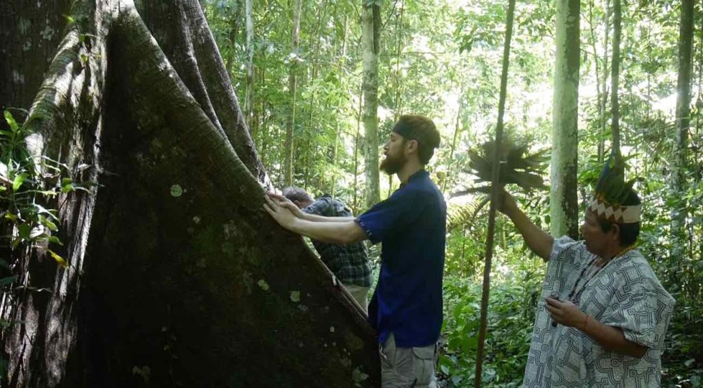 Apprentices doing a Lupuna blanca ritual with master shaman Don Armando, in the Peruvian Amazon jungle.