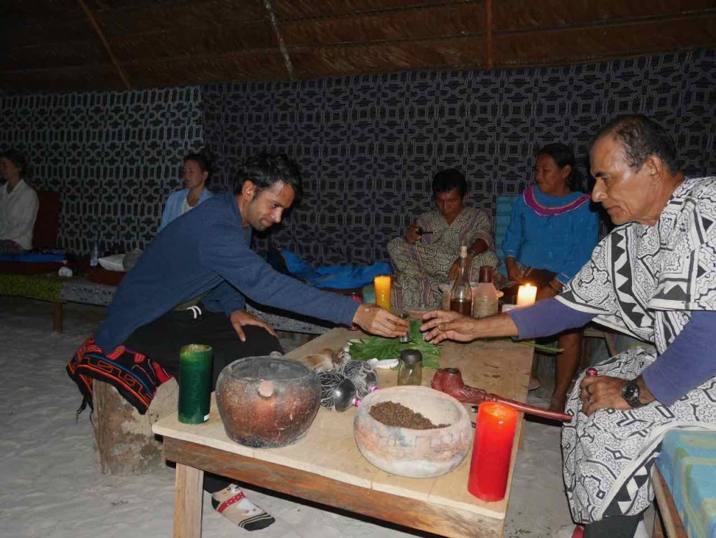 Toé (Brugmansia sp., Angel's trumpet) ceremony at night, with Don Guido in the jungle.
